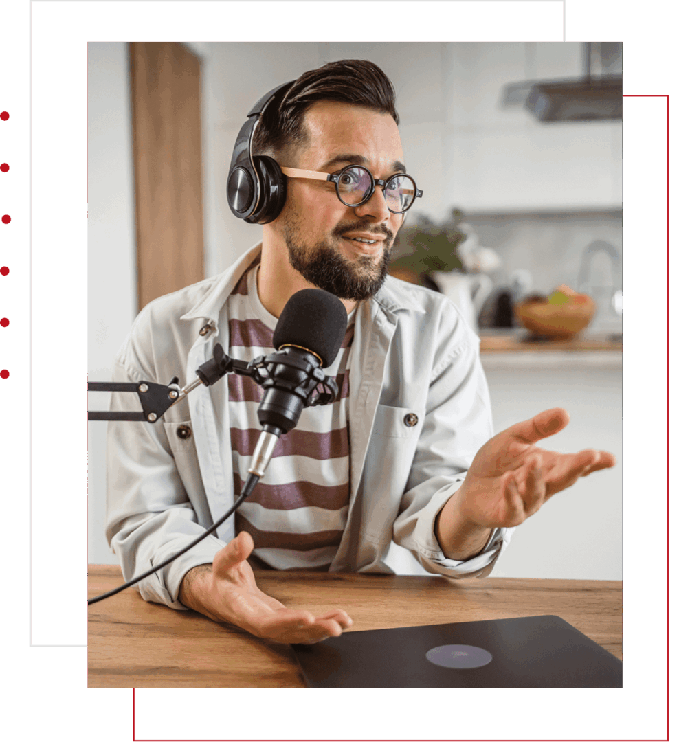 Man speaking into microphone with headphones on.