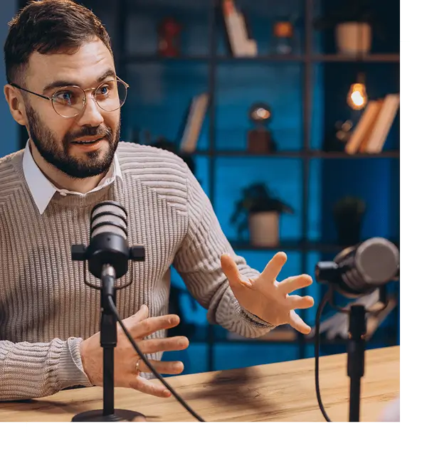Man speaking passionately into a microphone during a podcast.